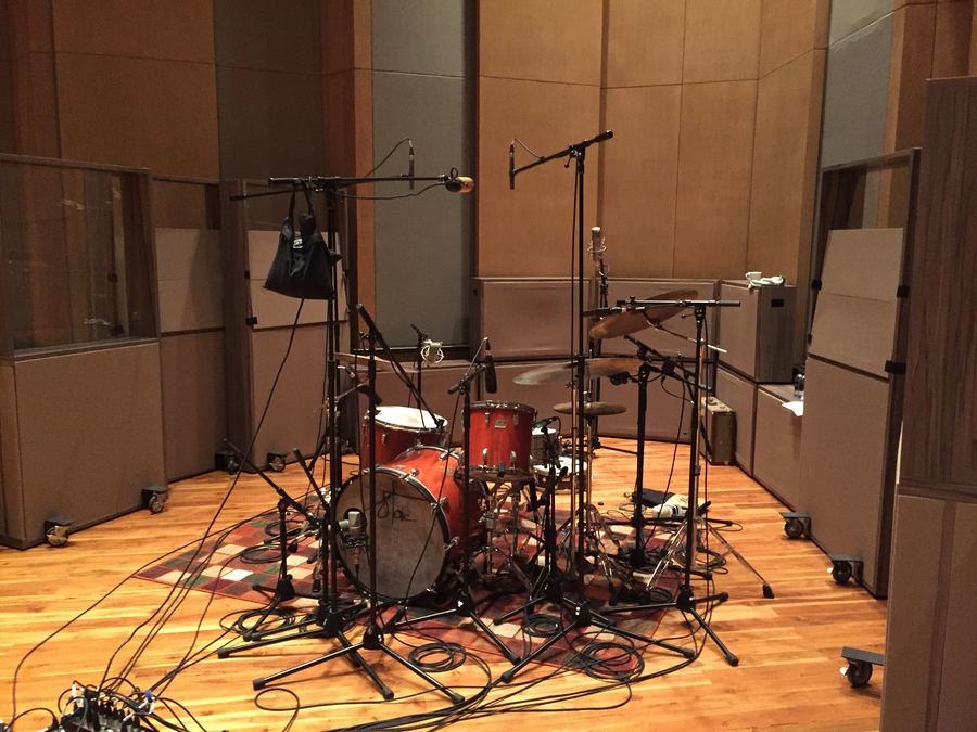 Drum kit set up in the large wood-panelled room