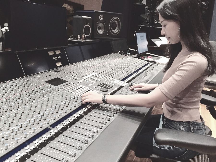 Engineer working at a large-format console