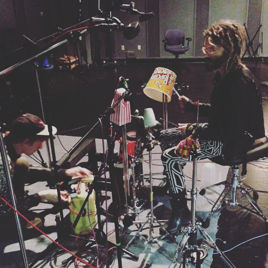 Percussionist surrounded by close microphones