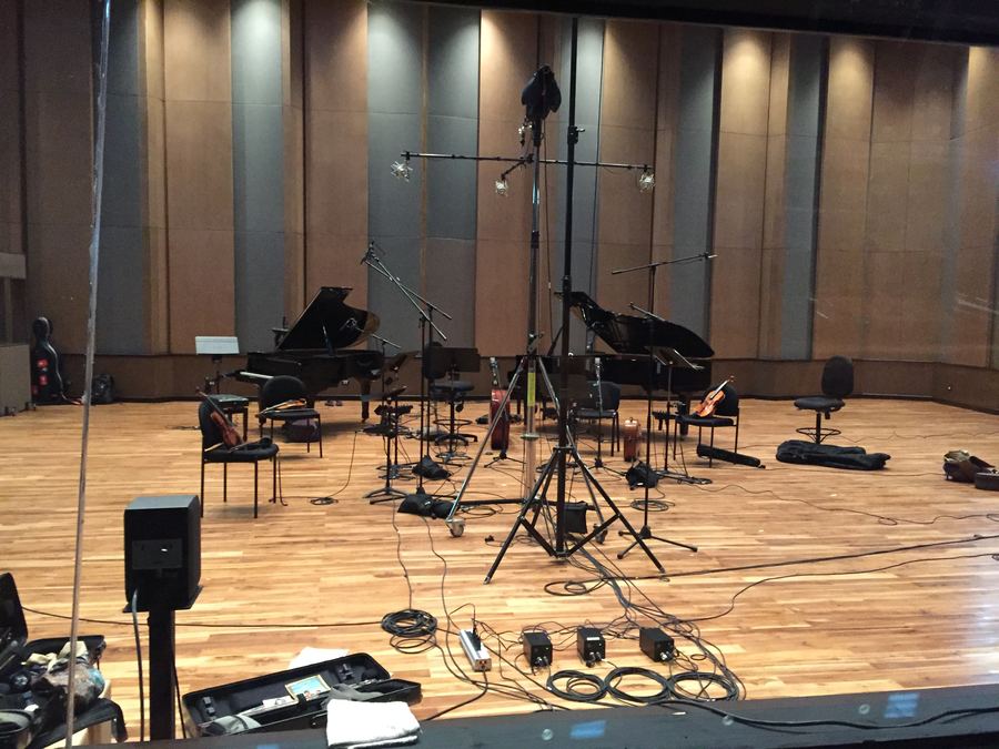 Two grand pianos and microphones set in the live room