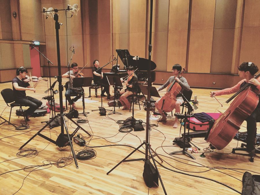 String section with microphones set across the live room