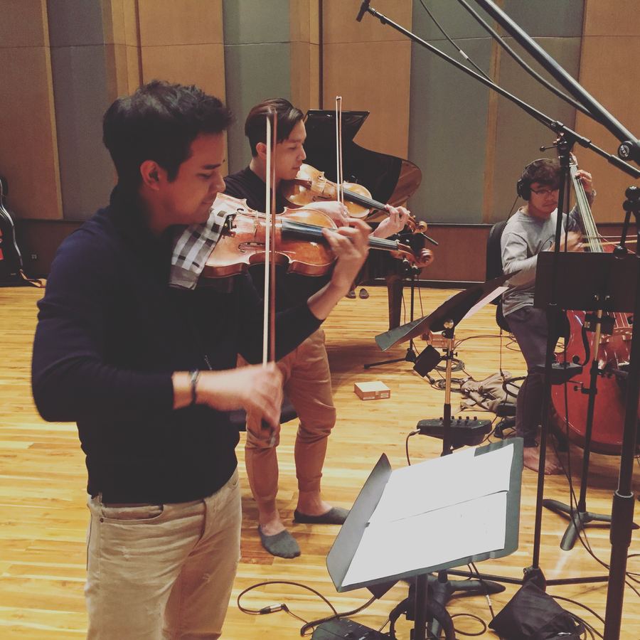 Violinist playing close to a microphone