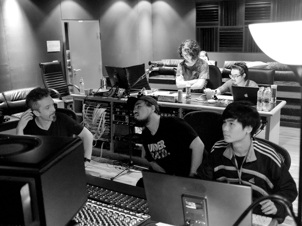 Engineers working together at the console in the Studio28 control room